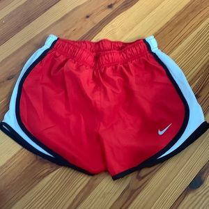 red nike shorts